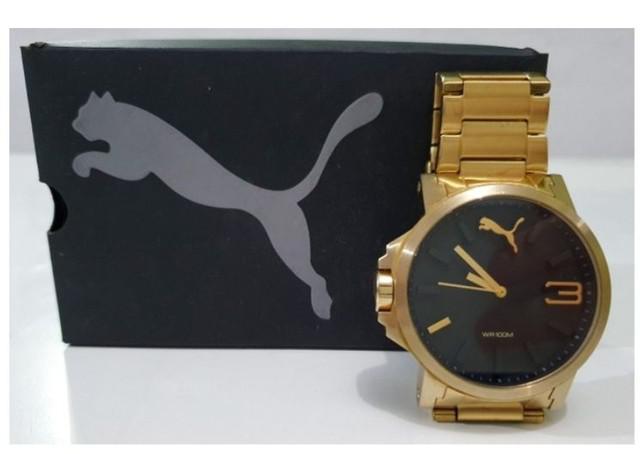 Relógio puma ultrasize metal dourado